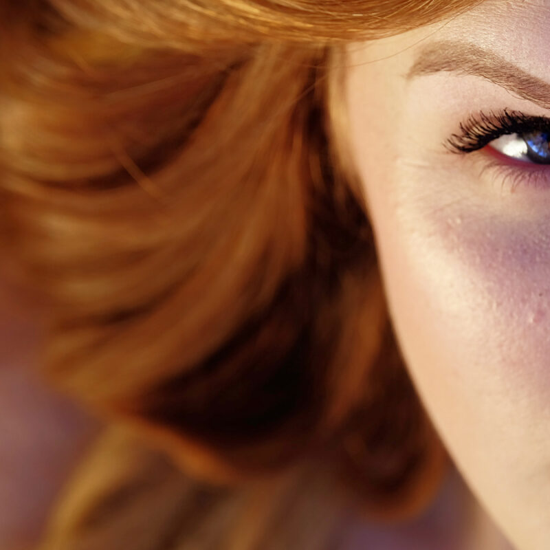 red haried woman with a determined look in her eyes
