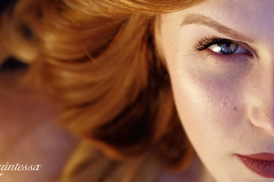 red haried woman with a determined look in her eyes
