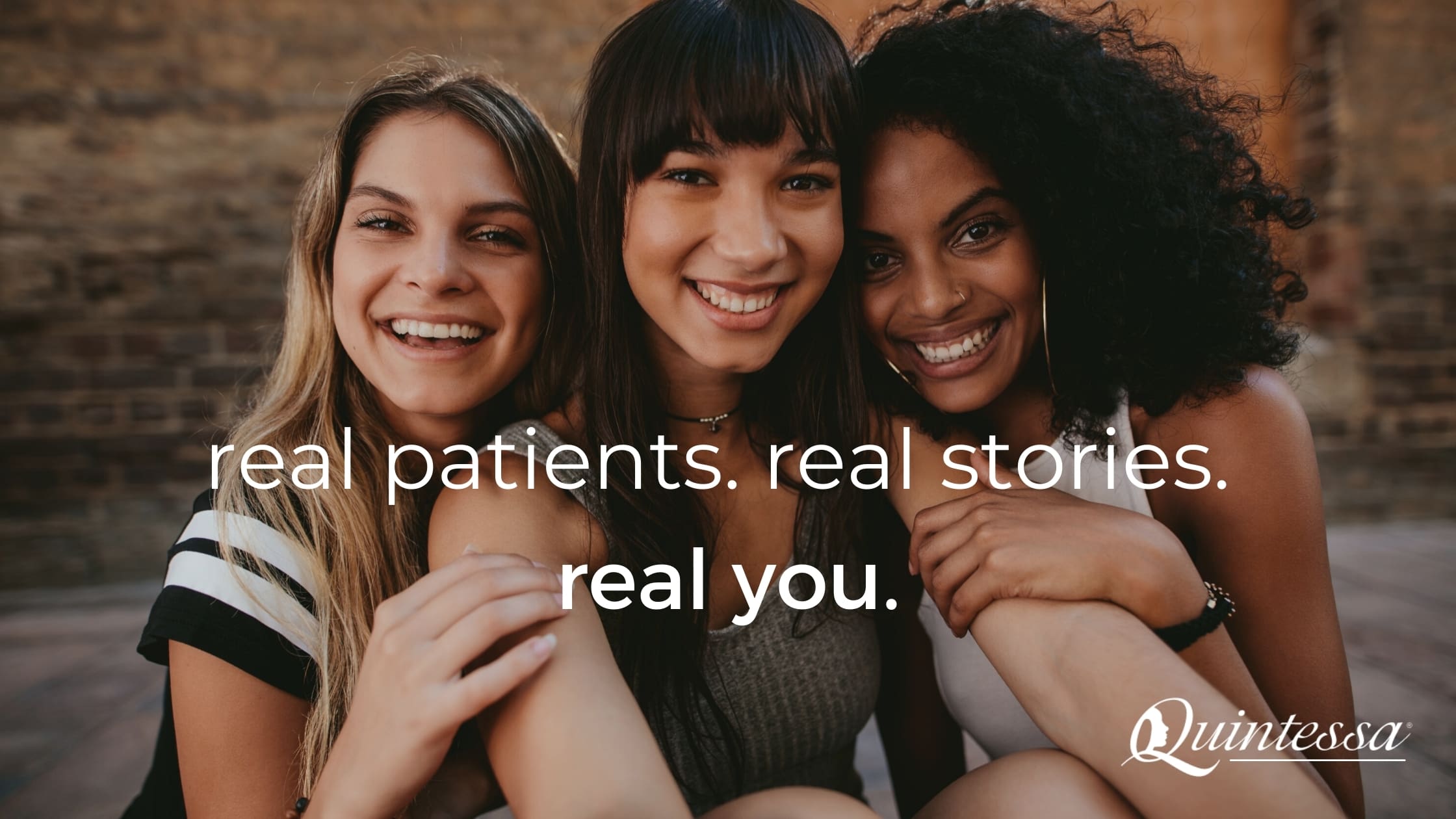 Three young women sitting next to each other smiling