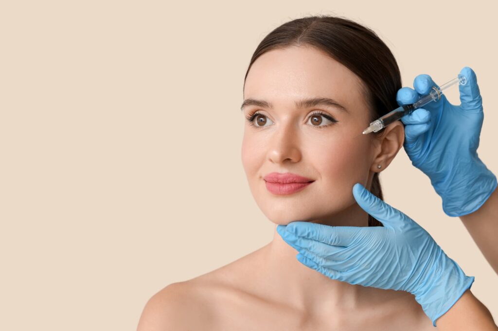 Close-up image of a patient receiving dermal fillers for enhanced facial contours.