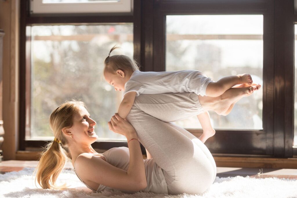 a mom and her baby after her mommy makeover in Milwaukee